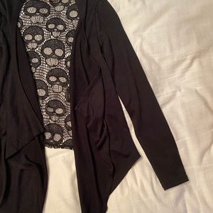 Black cover up skull